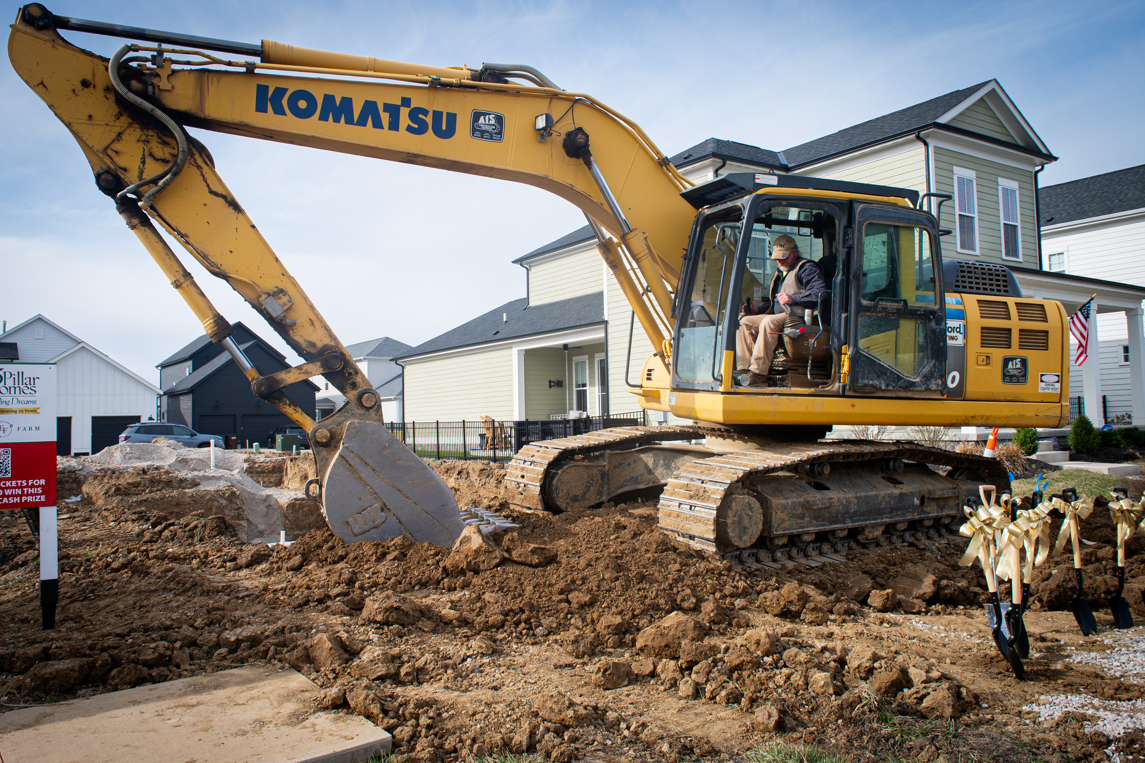 Komatsu truck digging at the building ceremony